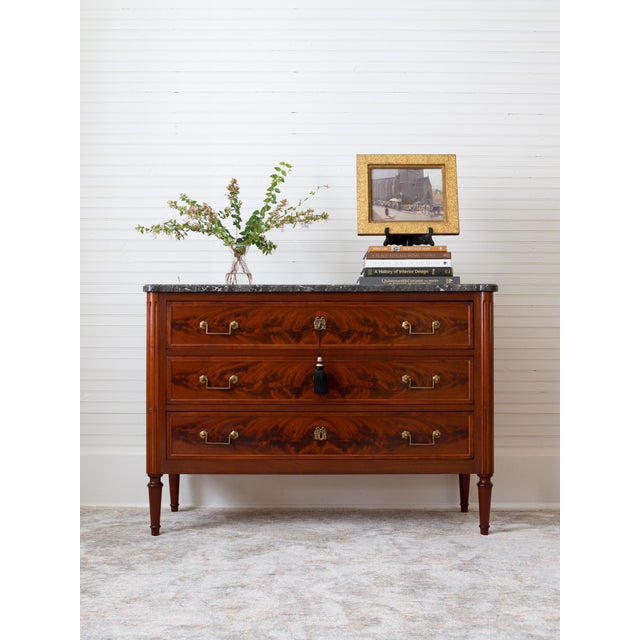 This chic piece is a French Louis XVI commode dating from the late 1800's. Inspired by the Neoclassical era in design,...