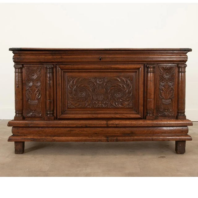 This solid oak coffer from the 1720s is full of gorgeous hand-carved details and a wonderful patina. Swirling acanthus...
