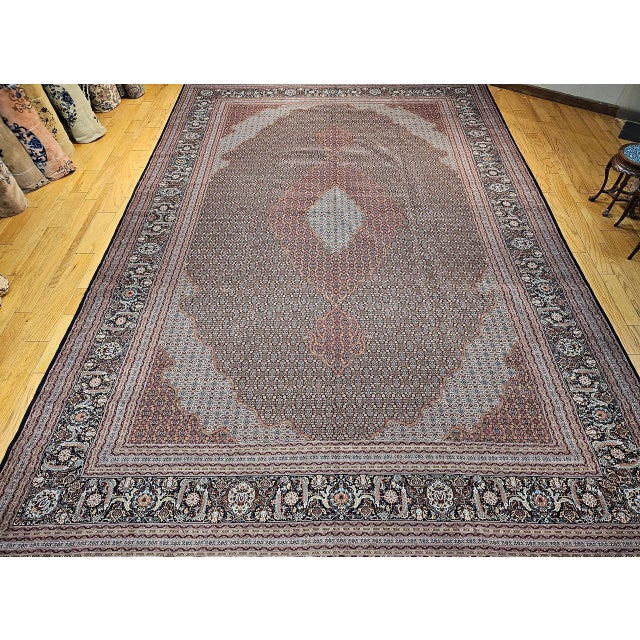 This breathtaking early 1900s Tabriz Mahi rug exemplifies the mastery of one of Tabriz’s finest city workshops, celebrated...