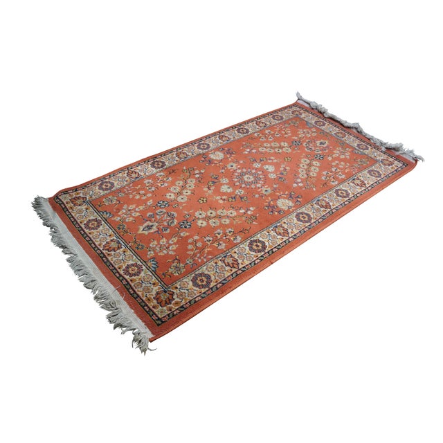 Vintage German Belgium Orienta rug runner featuring a floral medallion design in red / orange, blue, pink, green, and...