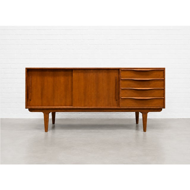 Mid Century Modern styled Handmade Credenza / Media Stand featuring exquisite sculptural hand pulls and plenty of shelving...