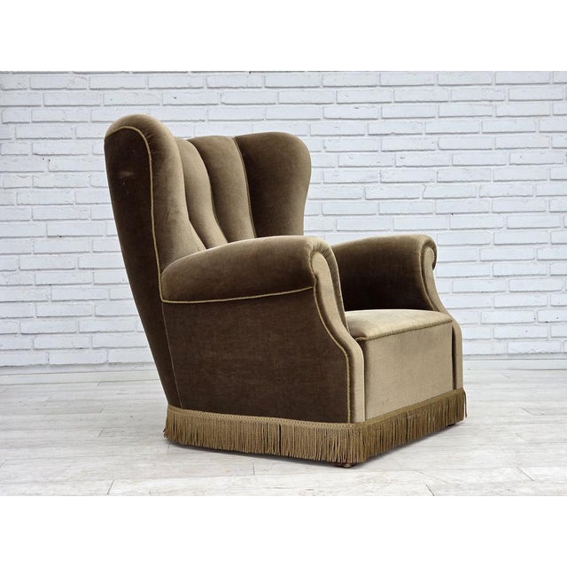 1960s, Danish relax armchair. Original dark green furniture velour, ash wood legs, brass springs in the seat. Original...
