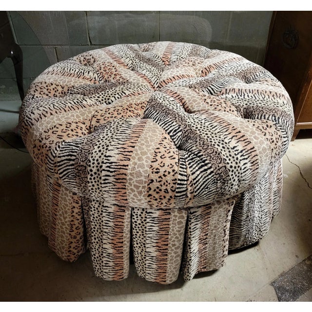 Large custom upholstered in a designer animal print velvet, this fabulous ottoman is tufted and skirted. The skirt is...