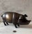 Large vintage late 20th century bronze piggy bank with rubber stopper on the underside of pig.