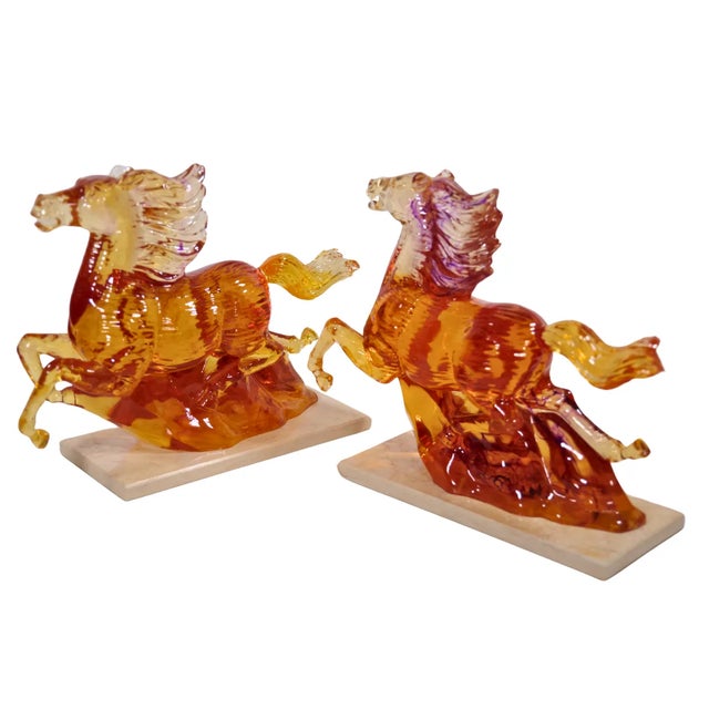 A Pair of Unique vintage acrylic running horse figurines with a breathtaking graduated amber color elegantly mounted on a...