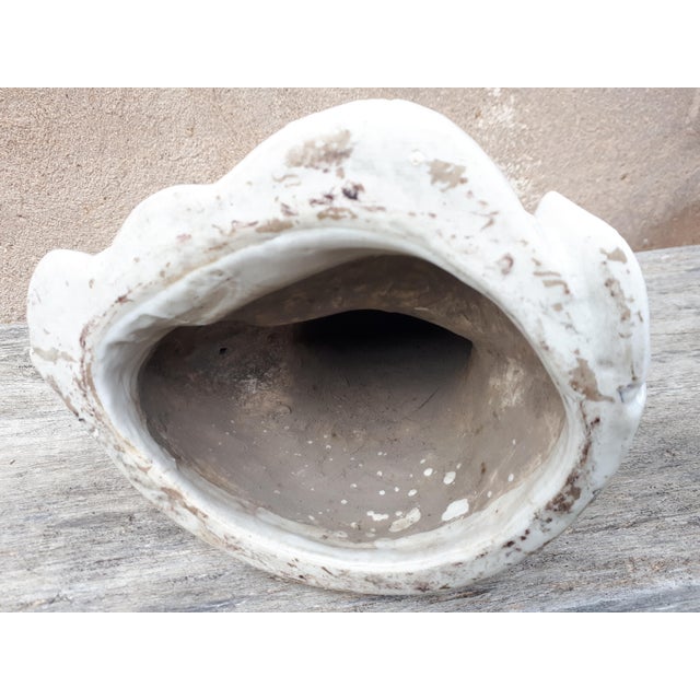 Guanyin statue in white-glazed porcelain, depicted in a position of royal relaxation. Note the two different glazes, one...