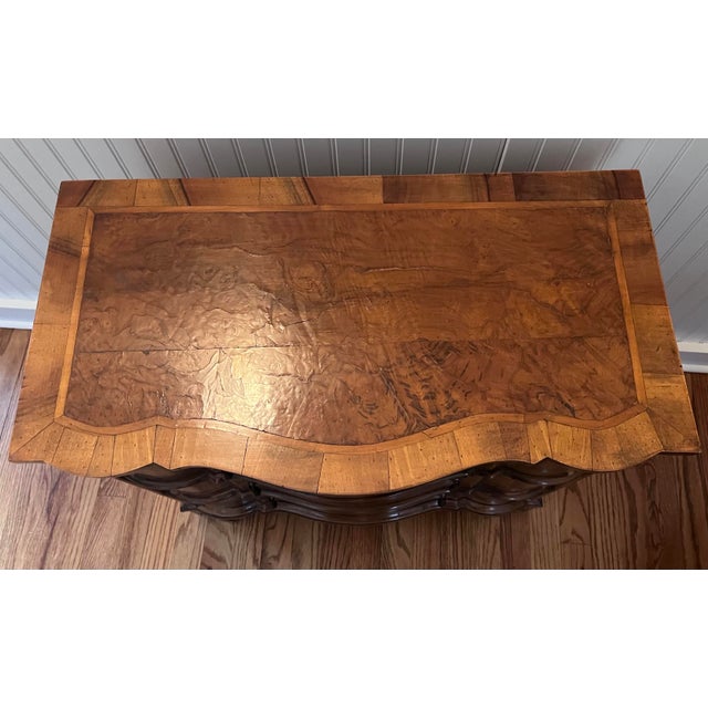 18th Century Baroque Serpentine Walnut Bachelor’s Chest. This small dresser features fabulous inlay, bronze hardware, and...