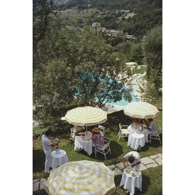 Chateau Saint-Martin 1986 by Slim Aarons Slim Aarons Limited Estate Edition An outdoor luncheon by the swimming pool of...