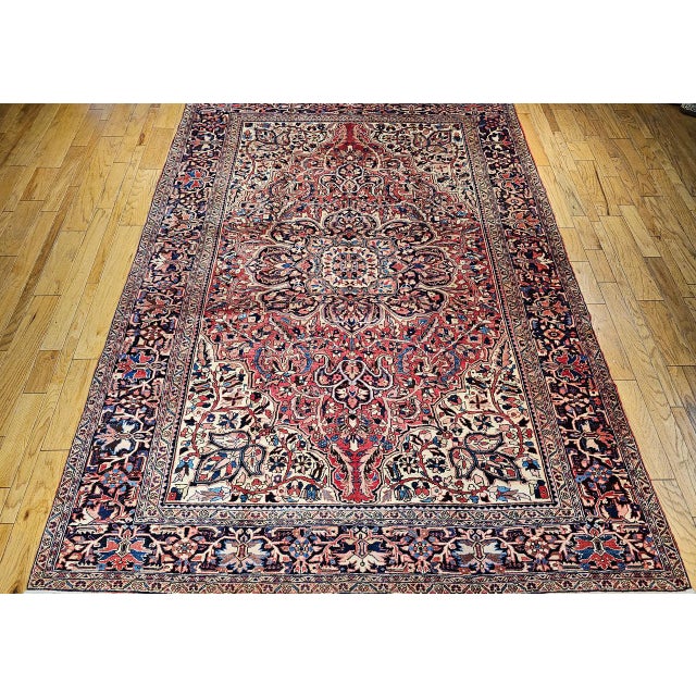 "Beautiful hand-knotted Persian Heriz in geometric pattern circa the early 20th Century. The rustic red field sets a warm...