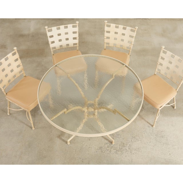 An Iconic Mid-Century Modern dining suite crafted in the Neoclassical style consisting of a set of four patio and garden...