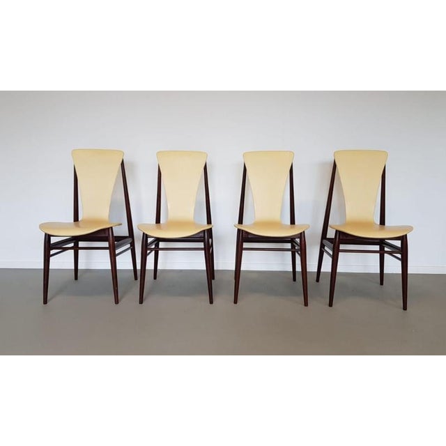 Set of 4 vintage Dutch design dining chairs in 1950s Danish Style. This rare set is in a great condition. "Floating chair"...
