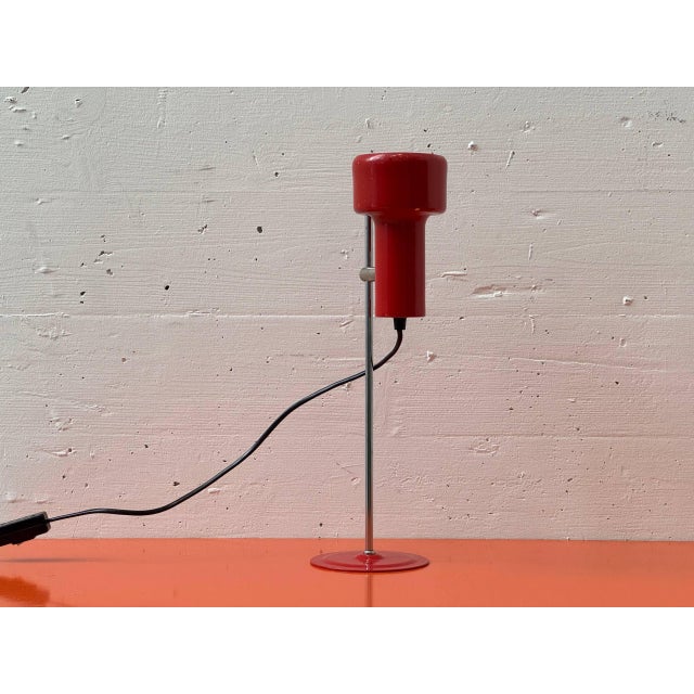 A compact table lamp from france, dating from the 1970s, with a clean, technical design language typical of european mid-...