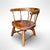 An antique children's captain’s chair, dating from the 19th century. Handcrafted from wood, it features a bentwood back...
