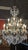 Here is a stunning large metal and crystal chandelier with 15 light arms in two tiers 28" round by 44" high. All original...