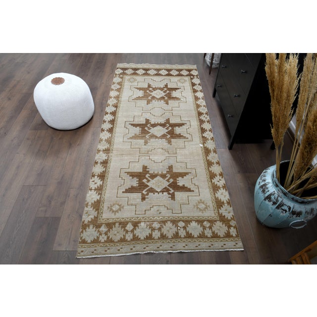 Vintage Turkish Hand-Knotted runner rug is a semi-antique vintage runner rug. The '70s Eastern region of Anatolian's...
