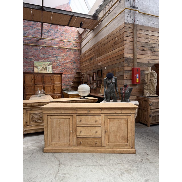This 19th-century sideboard made of unfinished oak has been fully restored. It features two solid doors that open to...