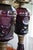 A striking matched pair of antique amethyst pressed-glass “Owl and Shield” oil lamps, conservatively attributed to the...