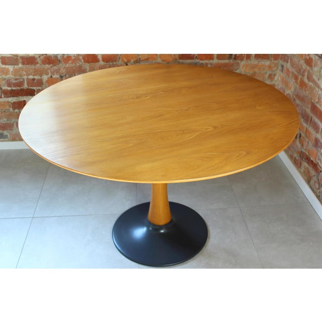Elegant mid-century modern round dining table produced by Drevotvar in the former Czechoslovakia during the 1960s-70s. A...