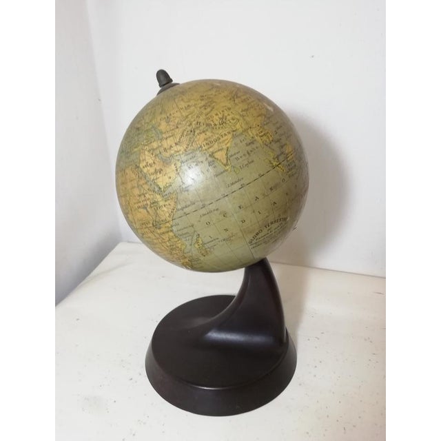 Antique vintage globe by Antonio Vallardi, made in the 1930s. Original Bakelite base. Paper-covered sphere. Good overall...