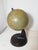 Antique vintage globe by Antonio Vallardi, made in the 1930s. Original Bakelite base. Paper-covered sphere. Good overall...