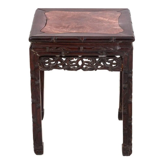 Chinese Carved Hardwood and Pink Marble Pedestal Table, late 19th century, a square top inset with marble. 20.5" H x 16" W...