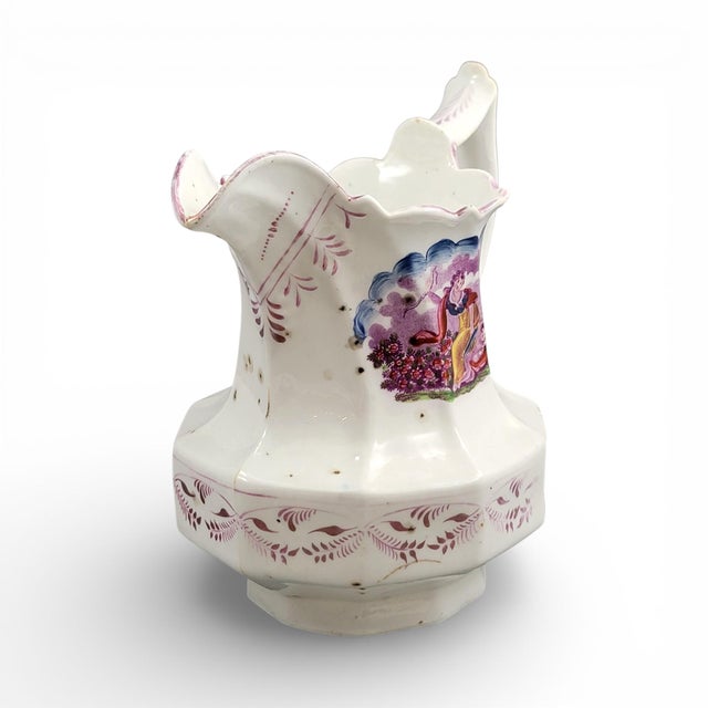 English Staffordshire pearlware jug dating to circa 1825–1840, in baluster form with softly faceted sides, a scalloped rim...