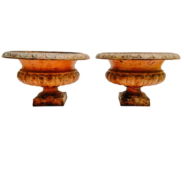 A pair of classic Medici style French cast iron urns from the early twentieth-century. Made from weighty cast iron, these...