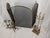 An elegant vintage brass fireplace ensemble offering a beautifully coordinated hearth presentation. The grouping includes...