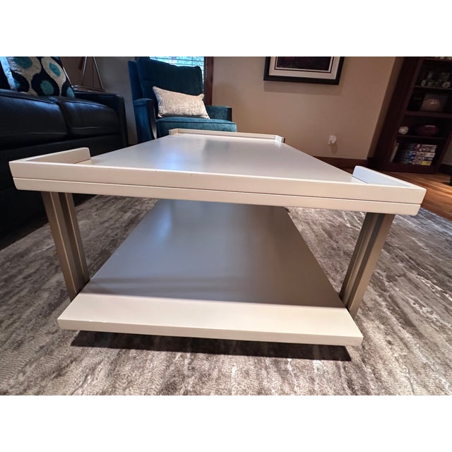 A glam, midcentury-meets-Hollywood-Regency style table. Table is in very good condition with one small ding on the lower...