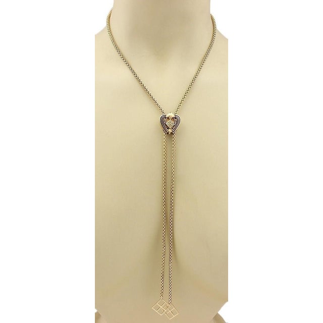 The Heart Slide 14k Gold Pendant Tube Filigree Chain Tassel Necklace is a vintage and original piece of fine jewelry. This...