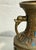 A richly decorated vintage Asian champlevé enamel vase featuring an archaistic form, intricate geometric texturing and a...