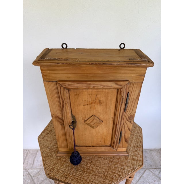 Charming 19th century European pine hanging cupboard with great personality and patina. Possibly Scandinavian, it has 2...