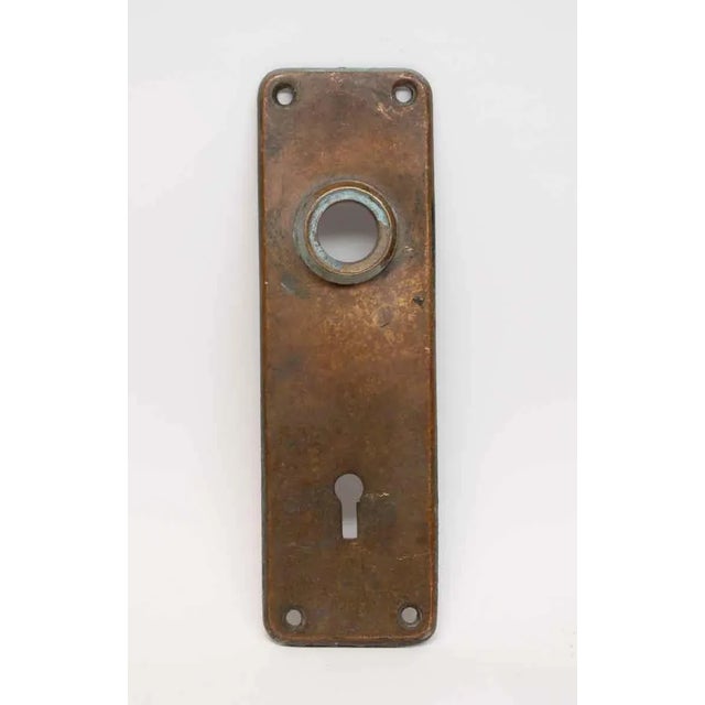 Sold bronze plain rounded corner door knob back plates. Patinas will vary. Some have scratches or verdigris. Priced per...