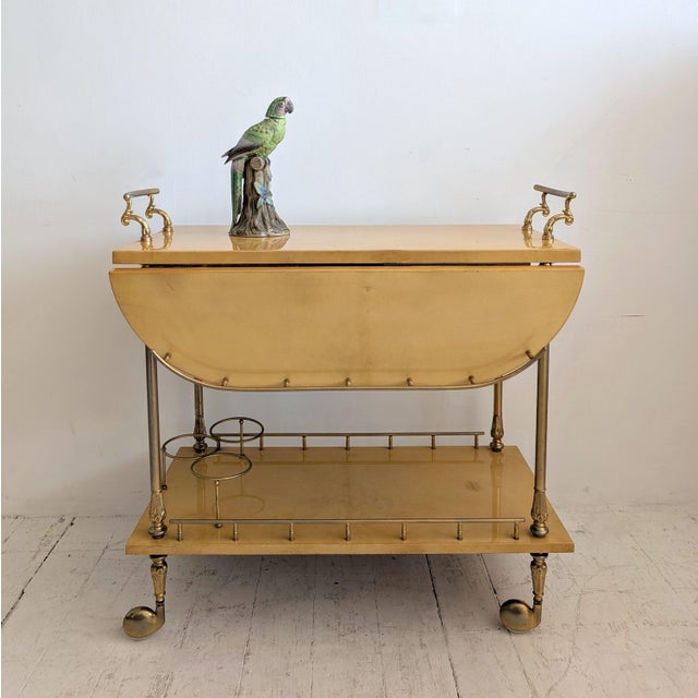 Rare Italian lacquered parchment two-tier drinks trolley by Aldo Tura, Italy 1960s. The upper tier of this trolley has two...