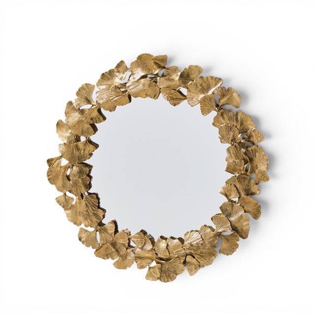Jay Strongwater Lola Ginkgo Leaf Gilt Round Wall Mirror This mirror measures: 23.5 wide x 1.75 deep x 23.5 inches high...