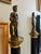 Pair of black-veined Neoclassical style architectural marble columns with a cast bronze classical warrior and the other...