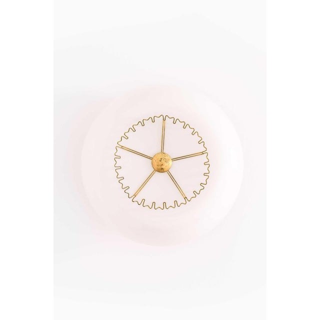 This very rare pair of flush mount ceiling lamps, designed by Lisa Johansson-Pape and produced by Stockmann-Orno in...