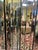 A striking vintage mirrored folding screen by Henredon, offering high-impact glamour and architectural presence. Composed...
