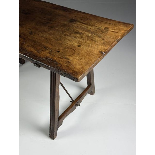 Spanish table. Originating from the 18th century. Solid walnut. Top made from just one plank. Sturdy and durable....