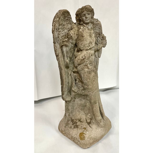 Vintage concrete garden statue. Standing angel with amazing details especially on the face and the outstretched wings. A...