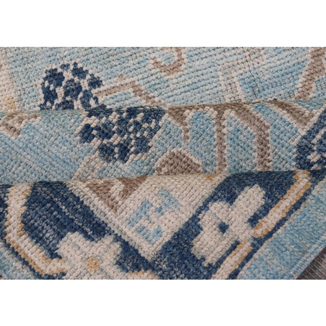 Turkish Khotan Designed Runner With Pomegranate Design in Cream, Tan and Blues For Sale - Image 10 of 11