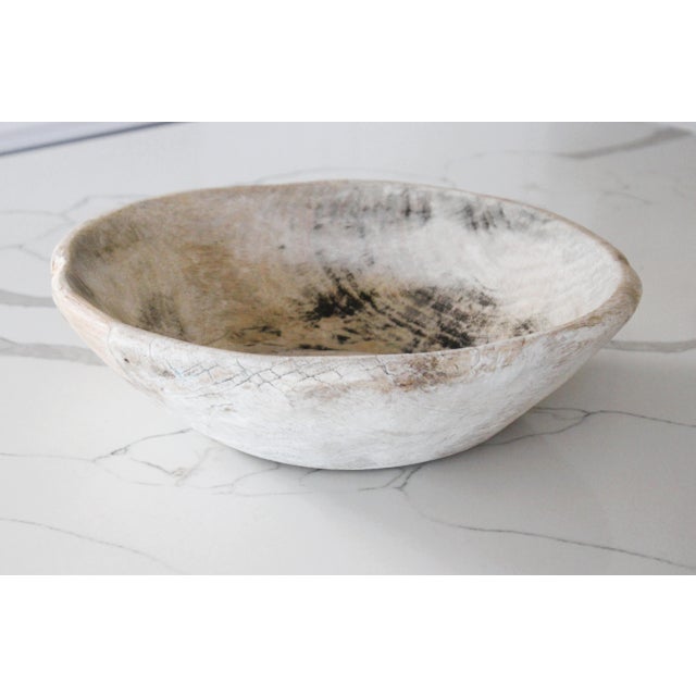 Bleached antique distressed dough bowl. Showing signs of time worn use, with wear along the rim's edges from the baker....