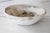 Bleached antique distressed dough bowl. Showing signs of time worn use, with wear along the rim's edges from the baker....