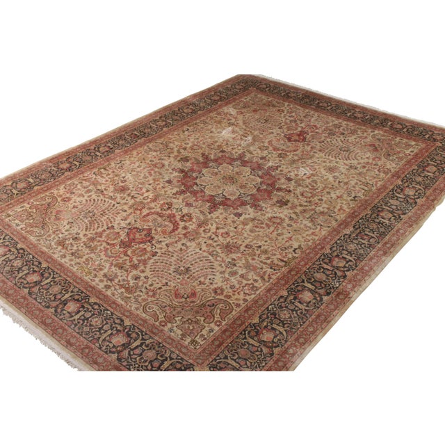 Hand knotted in wool originating circa 1950-1960, this 11x15 vintage Persian rug connotes a mid-century Tabriz rug style...