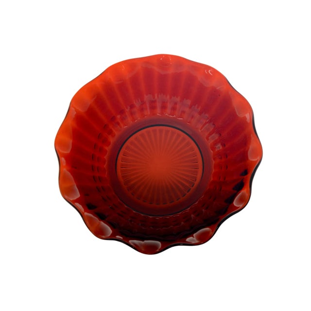 Ruby red glass six inch bowl with gentle wave rim and fluted pattern. Simply a beautiful vintage addition to the...