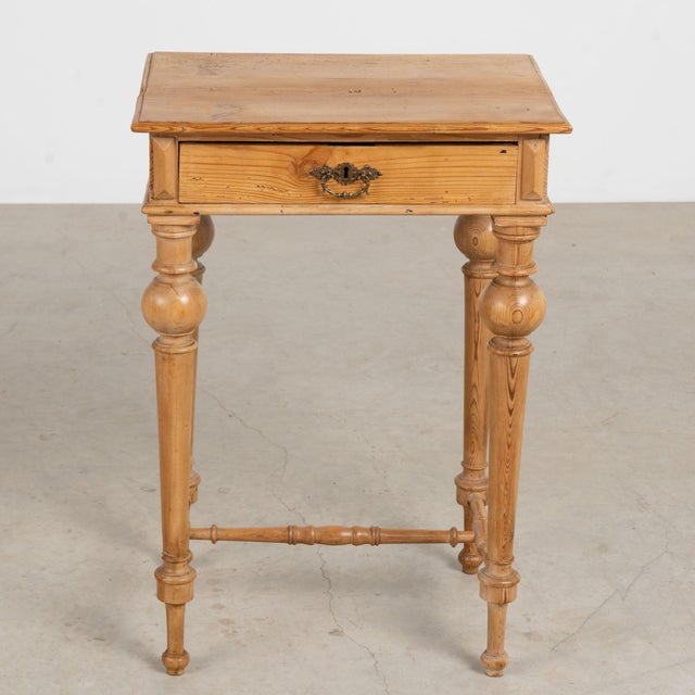 Danish country pine side table with attractive turned legs and stretcher; small single drawer. Note the drawer has a...