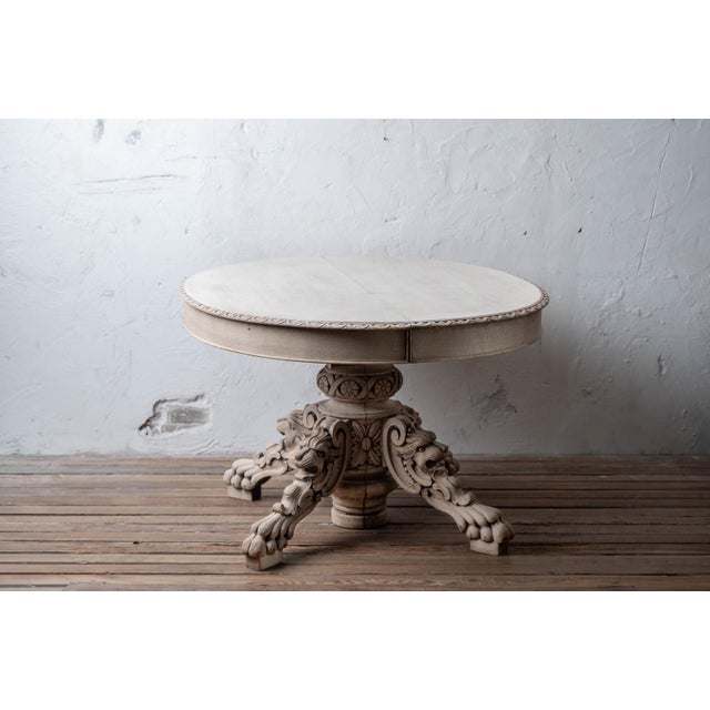 A French Henri II carved oak oval centre or dining table, the surface bleached to a pale, dry finish. The oval top has a...