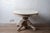 A French Henri II carved oak oval centre or dining table, the surface bleached to a pale, dry finish. The oval top has a...