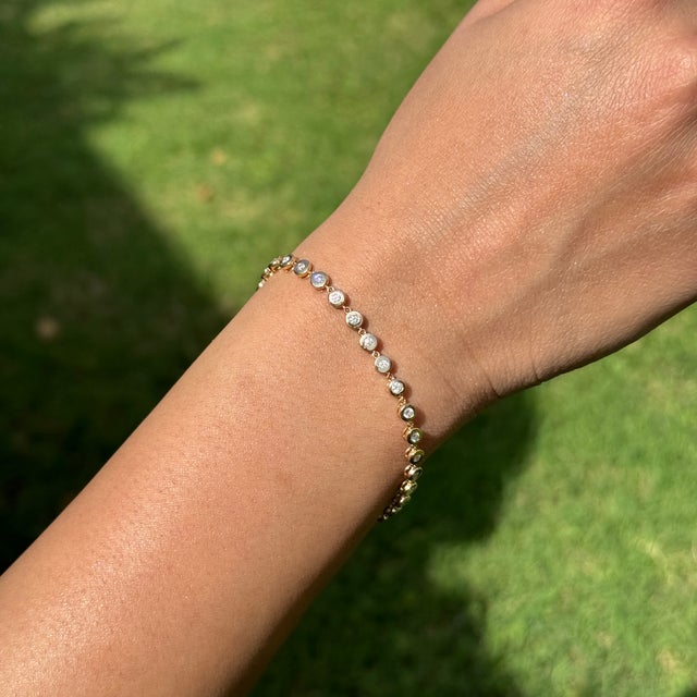 This elegant bracelet features 0.87 carats of sparkling diamonds, set in 14K yellow gold. each measuring approximately 1.8...