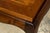 Elegant 1940s French Art Deco coffee table sourced in Paris, France. Crafted in walnut, the table features a rectangular...